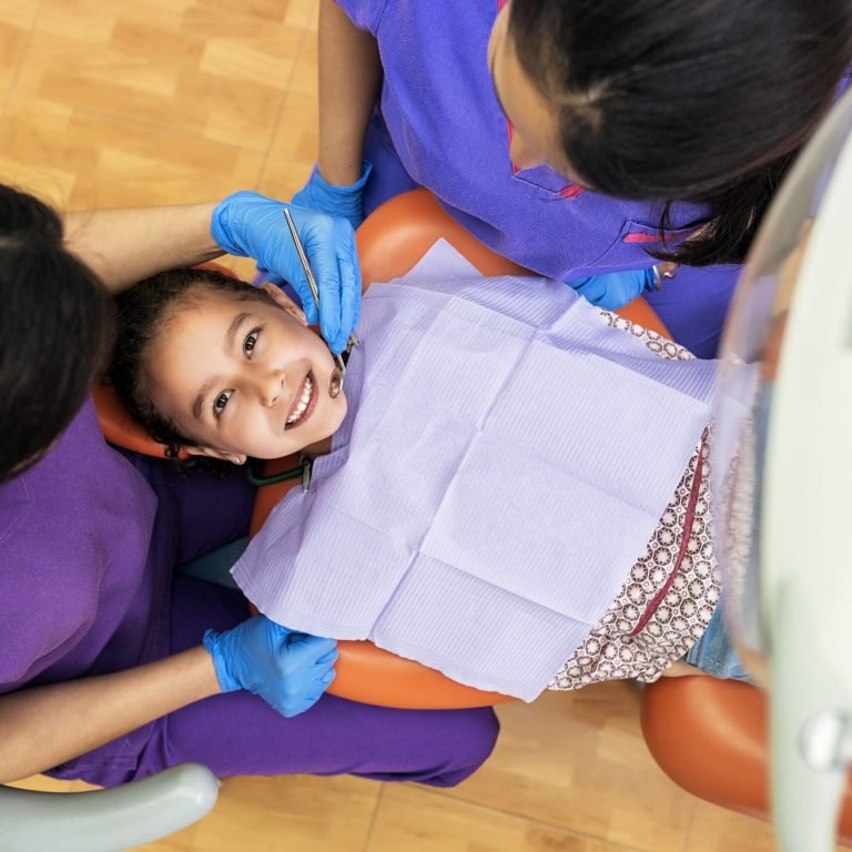 Dentists during a dental intervention with a patient. Dentist Concept